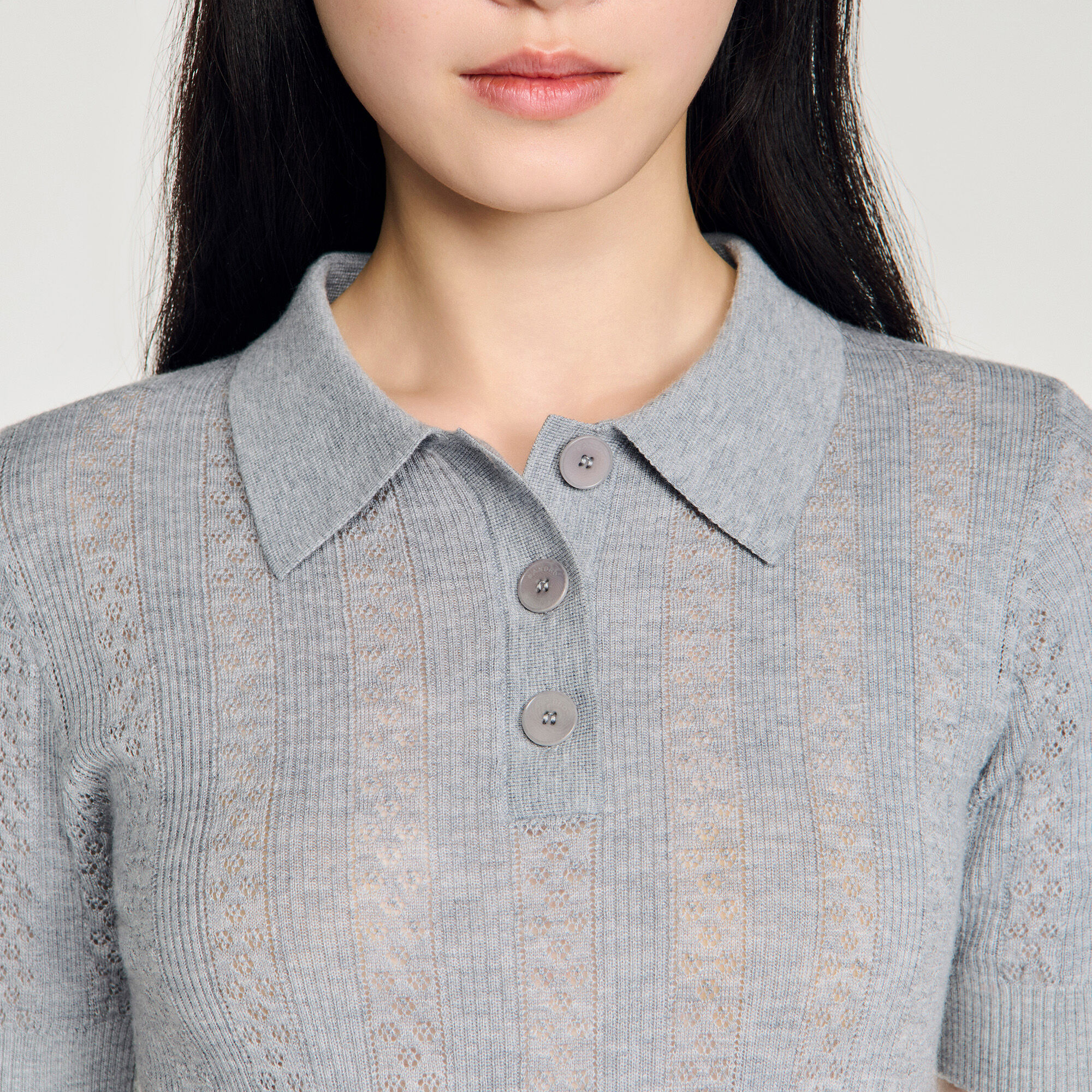 Sweater de lana con cuello polo punto pointelle