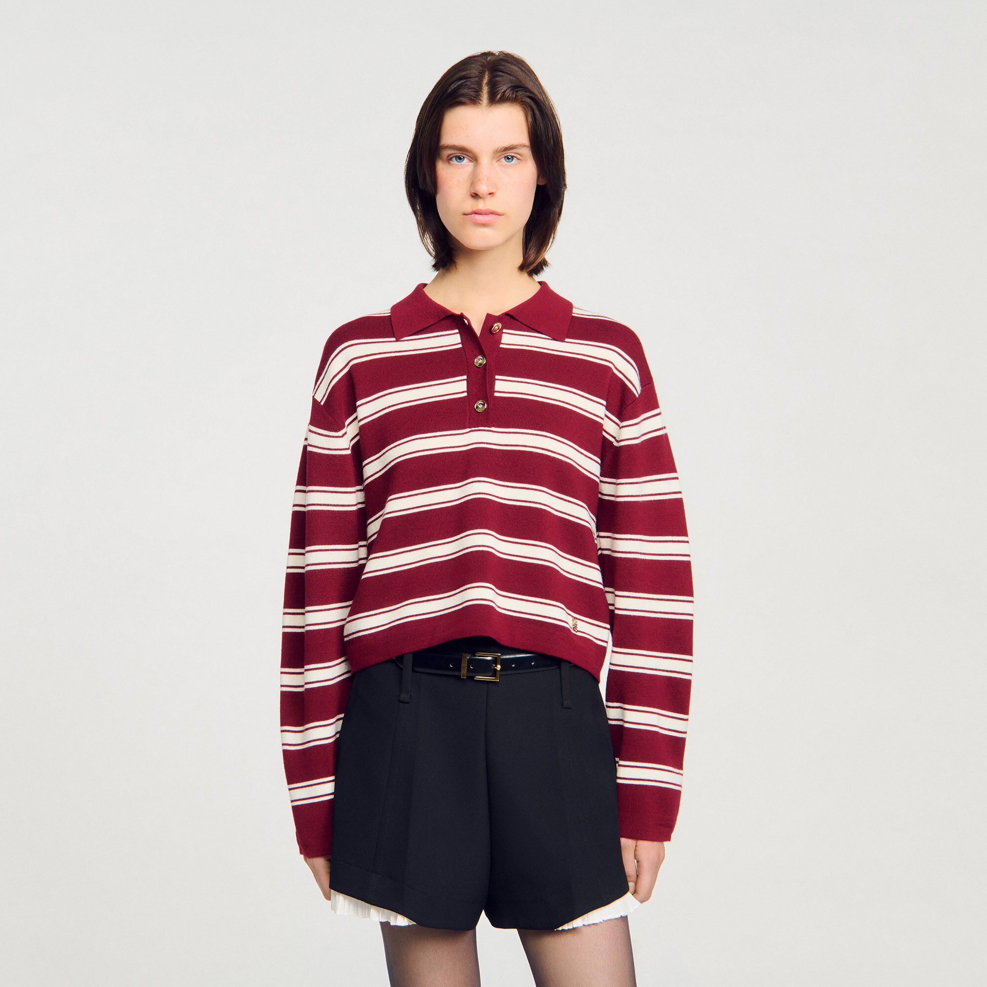 Sweater de lana con rayas estilo polo