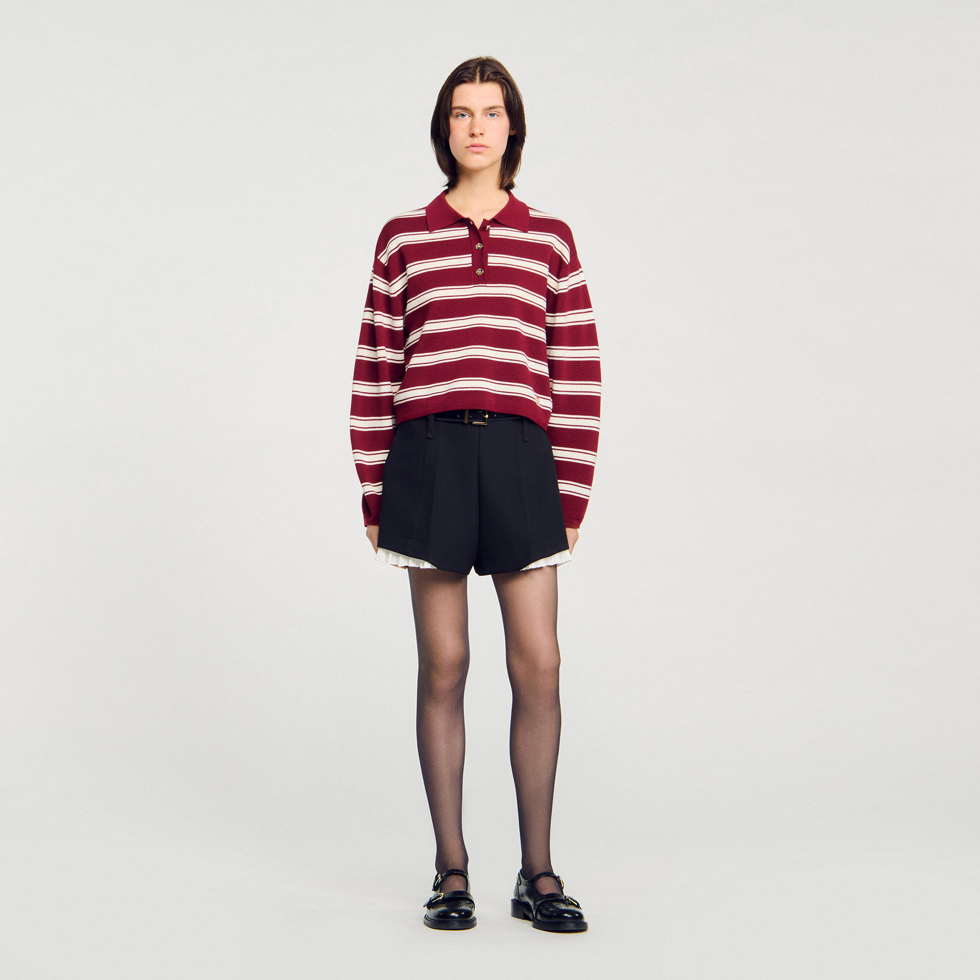 Sweater de lana con rayas estilo polo
