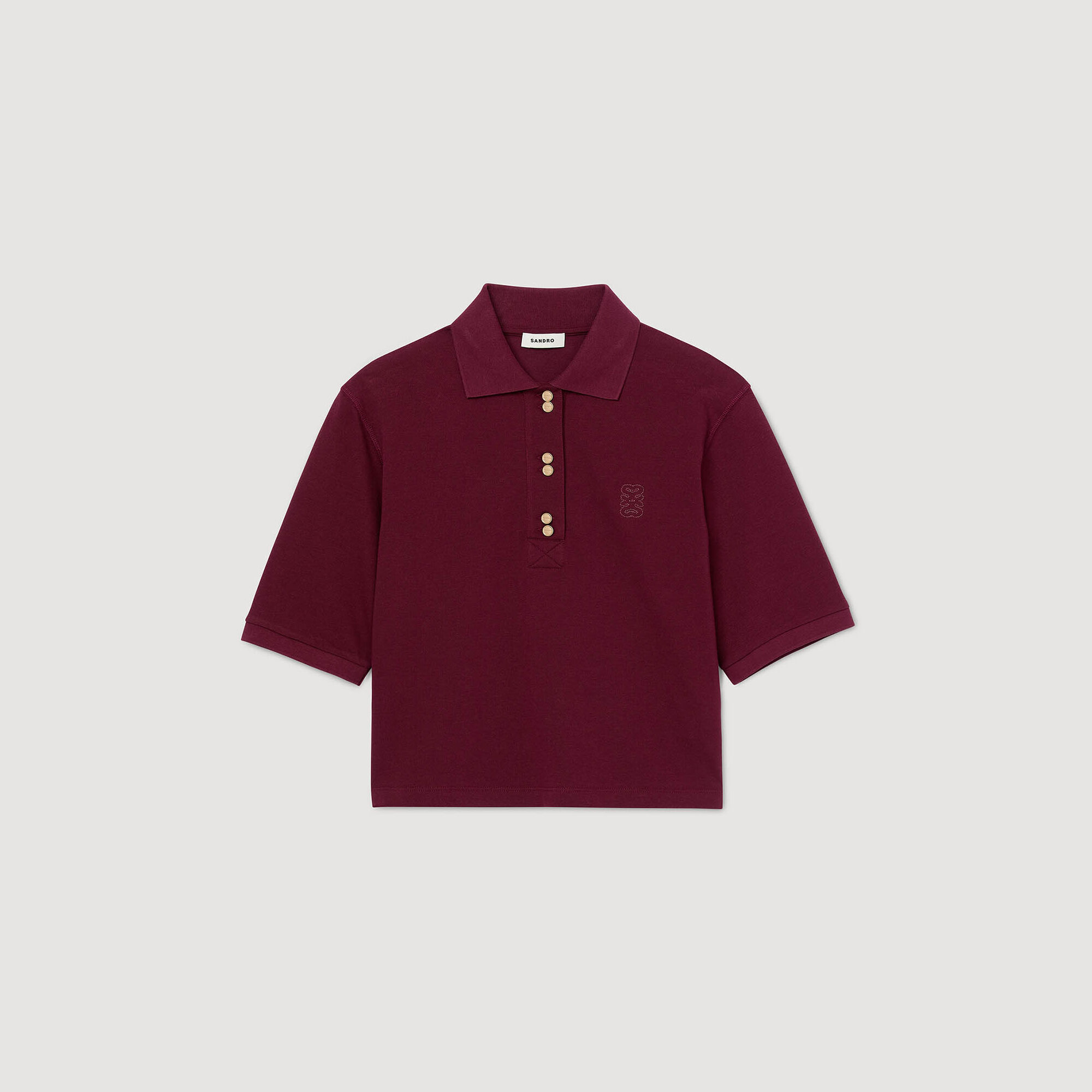 Camiseta polo con botones decorativos